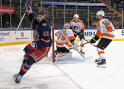 Mar 17, 2021; New York, New York, USA; New York Rangers center Mika Zibanejad (93) celebrates after scoring a power-play goal against Philadelphia Flyers goaltender Carter Hart (79) at 14:29 of the second period at Madison Square Garden. Mandatory Credit:  Bruce Bennett/POOL PHOTOS-USA TODAY Sports