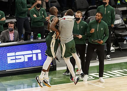 May 22, 2021; Milwaukee, Wisconsin, USA;  Milwaukee Bucks forward Khris Middleton (22) celebrates after making a basket during overtime against the Miami Heat during game one in the first round of the 2021 NBA Playoffs at Fiserv Forum. Mandatory Credit: Jeff Hanisch-USA TODAY Sports