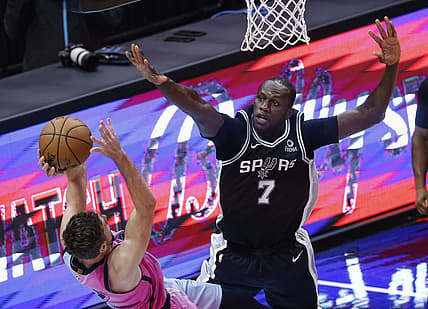 Apr 28, 2021; Miami, Florida, USA;  San Antonio Spurs center Gorgui Dieng (7) defends Miami Heat guard Giran Dragic (7) during the second half at American Airlines Arena. Mandatory Credit: Rhona Wise-USA TODAY Sports