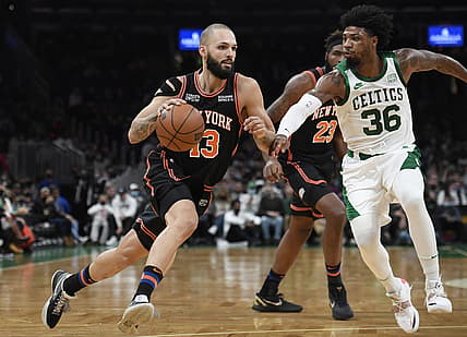 Dec 18, 2021; Boston, Massachusetts, USA;  New York Knicks guard Evan Fournier (13) drives to the basket while Boston Celtics guard Marcus Smart (36) defends during the first half at TD Garden. Mandatory Credit: Bob DeChiara-USA TODAY Sports