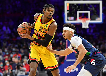 Dec 23, 2021; Philadelphia, Pennsylvania, USA; Atlanta Hawks forward Cam Reddish (22) is defended by Philadelphia 76ers guard Seth Curry (31) during the first quarter at Wells Fargo Center. Mandatory Credit: Eric Hartline-USA TODAY Sports