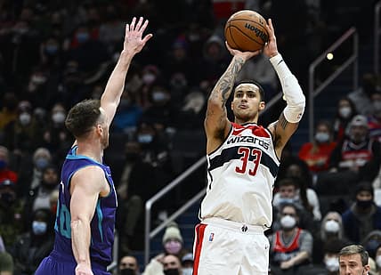 Jan 3, 2022; Washington, District of Columbia, USA; Washington Wizards forward Kyle Kuzma (33) shoots over Charlotte Hornets forward Gordon Hayward (20) during the second half at Capital One Arena. Mandatory Credit: Brad Mills-USA TODAY Sports