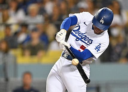 Jul 8, 2022; Los Angeles, California, USA;  Los Angeles Dodgers first baseman Freddie Freeman (5) hits a double against the Chicago Cubs in the sixth inning at Dodger Stadium. Mandatory Credit: Jayne Kamin-Oncea-USA TODAY Sports