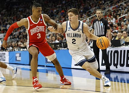 Mar 20, 2022; Pittsburgh, PA, USA; Villanova Wildcats guard Collin Gillespie (2) dribbles the ball past Ohio State Buckeyes guard Eugene Brown III (3) in the second half during the second round of the 2022 NCAA Tournament at PPG Paints Arena. Mandatory Credit: Geoff Burke-USA TODAY Sports