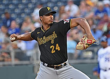 Aug 28, 2023; Kansas City, Missouri, USA;  Pittsburgh Pirates starting pitcher Johan Oviedo (24) delivers a pitch in the first inning against the Kansas City Royals at Kauffman Stadium. Mandatory Credit: Peter Aiken-USA TODAY Sports