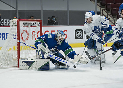 Mar 4, 2021; Vancouver, British Columbia, CAN; Vancouver Canucks goalie Thatcher Demko (35) makes a save on Toronto Maple Leafs forward  Zach Hyman (11) in the first period at Rogers Arena. Mandatory Credit: Bob Frid-USA TODAY Sports