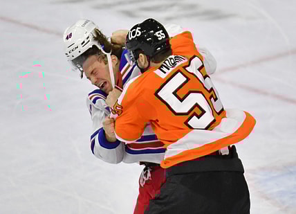 Mar 25, 2021; Philadelphia, Pennsylvania, USA; Philadelphia Flyers defenseman Samuel Morin (55) throws a punch against New York Rangers left wing Brendan Lemieux (48) during the third period at Wells Fargo Center. Mandatory Credit: Eric Hartline-USA TODAY Sports