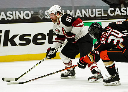 Apr 2, 2021; Anaheim, California, USA; Arizona Coyotes right wing Phil Kessel (81) moves in for a shot on goal ahead of Anaheim Ducks defenseman Jamie Drysdale (34) during the third period at Honda Center. Mandatory Credit: Gary A. Vasquez-USA TODAY Sports