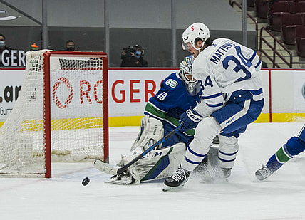 Apr 20, 2021; Vancouver, British Columbia, CAN;  Vancouver Canucks goalie Braden Holtby (49) makes a save on Toronto Maple Leafs forward Auston Matthews (34) in the first period at Rogers Arena. Mandatory Credit: Bob Frid-USA TODAY Sports