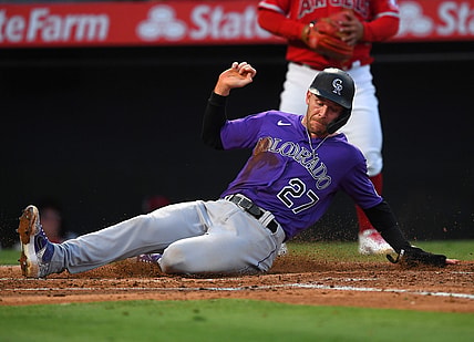 Jul 27, 2021; Anaheim, California, USA;  Colorado Rockies shortstop Trevor Story (27) scores on a single by right fielder Charlie Blackmon (not pictured) against the Colorado Rockies in the third inning at Angel Stadium. Mandatory Credit: Jayne Kamin-Oncea-USA TODAY Sports