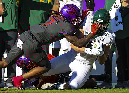 Nov 6, 2021; Fort Worth, Texas, USA;  TCU Horned Frogs safety T.J. Carter (7) tackles Baylor Bears tight end Ben Sims (86) during the first half at Amon G. Carter Stadium. Mandatory Credit: Kevin Jairaj-USA TODAY Sports