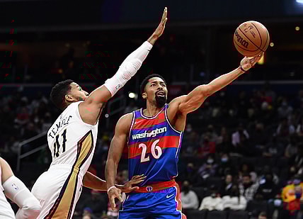 Nov 15, 2021; Washington, District of Columbia, USA; Washington Wizards guard Spencer Dinwiddie (26) shoots as New Orleans Pelicans forward Garrett Temple (41) defends during the first half at Capital One Arena. Mandatory Credit: Brad Mills-USA TODAY Sports