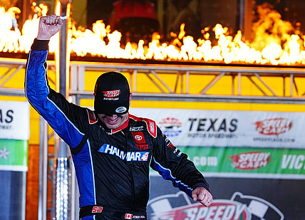 May 20, 2022; Fort Worth, Texas, USA; Camping World Truck Series driver Stewart Friesen (52) celebrates in victory lane after winning the SpeedyCash.com 220 at Texas Motor Speedway. Mandatory Credit: John David Mercer-USA TODAY Sports