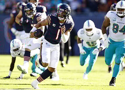 Nov 6, 2022; Chicago, Illinois, USA; Chicago Bears quarterback Justin Fields (1) rushes the ball for a touchdown against the Miami Dolphins during the second half at Soldier Field. Mandatory Credit: Mike Dinovo-USA TODAY Sports