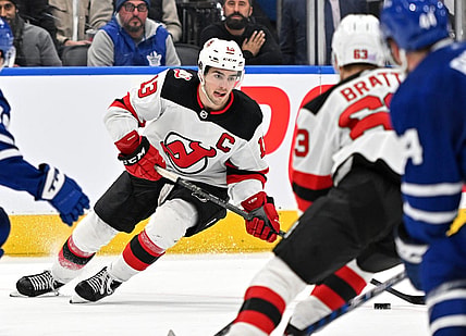 Nov 17, 2022; Toronto, Ontario, CAN; New Jersey Devils forward Nico Hischier (13) skates with the puck against the Toronto Maple Leaf in the third period at Scotiabank Arena. Mandatory Credit: Dan Hamilton-USA TODAY Sports