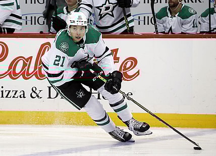 Dec 12, 2022; Pittsburgh, Pennsylvania, USA; Dallas Stars left wing Jason Robertson (21) skates with the puck against the Pittsburgh Penguins during the third period at PPG Paints Arena. The Penguins won 2-1. Mandatory Credit: Charles LeClaire-USA TODAY Sports