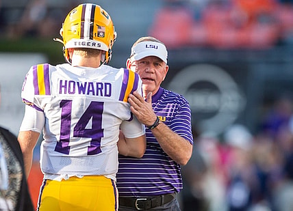 LSU Tigers head coach Brian Kelly talks with LSU Tigers quarterback Walker Howard (14) during warm ups before Auburn Tigers take on LSU Tigers at Jordan-Hare Stadium in Auburn, Ala., on Saturday, Oct. 1, 2022.