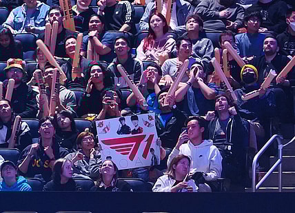 Nov 5, 2022; San Francisco, California, USA;  A fan holds a sign for T1 during the League of Legends World Championships against DRX at Chase Center. Mandatory Credit: Kelley L Cox-USA TODAY Sports