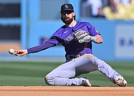 Oct 2, 2022; Los Angeles, California, USA; Colorado Rockies second baseman Brendan Rodgers (7) makes a play to throw out Los Angeles Dodgers first baseman Freddie Freeman (5) at second base in the sixth inning at Dodger Stadium. Mandatory Credit: Jayne Kamin-Oncea-USA TODAY Sports