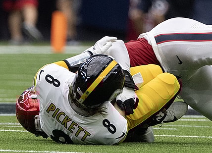 Oct 1, 2023; Houston, Texas, USA; Pittsburgh Steelers quarterback Kenny Pickett (8) is injured as he is sacked by Houston Texans defensive end Jonathan Greenard (52) in the second half at NRG Stadium. Mandatory Credit: Thomas Shea-USA TODAY Sports