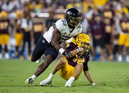 Oct 7, 2023; Tempe, Arizona, USA; Arizona State Sun Devils quarterback Trenton Bourguet (16) is sacked by Colorado Buffaloes defensive end Arden Walker (53) in the second half at Mountain America Stadium. Mandatory Credit: Mark J. Rebilas-USA TODAY Sports
