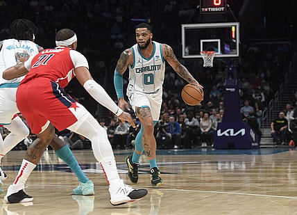 Nov 22, 2023; Charlotte, North Carolina, USA; Charlotte Hornets forward Miles Bridges (0) looks to drive during the first half against the Washington Wizards at the Spectrum Center. Mandatory Credit: Sam Sharpe-USA TODAY Sports