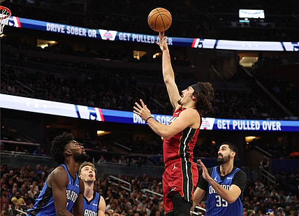 Dec 20, 2023; Orlando, Florida, USA; Miami Heat guard Jaime Jaquez Jr. (11) shoots a layup against the Orlando Magic during the first quarter at KIA Center. Mandatory Credit: Kim Klement Neitzel-USA TODAY Sports