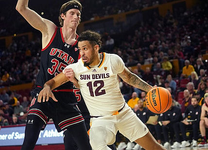 Jan 4, 2024; Tempe, Arizona, USA; ASU Sun Devils guard Jose Perez (12) drives past Utah Utes center Branden Carlson (35) at Desert Financial Arena.