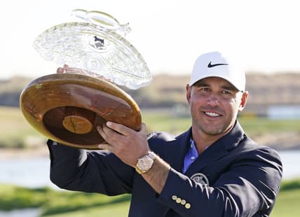 Feb 7, 2021; Scottsdale, Arizona, USA; Brooks Koepka poses with the trophy after winning the Waste Management Phoenix Open at TPC Scottsdale. Mandatory Credit: Rob Schumacher-USA TODAY Sports