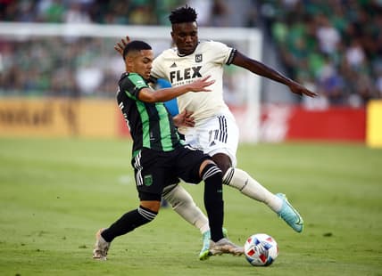 Jul 7, 2021; Austin, TX, Austin, TX, USA;  Austin FC midfielder Daniel Pereira (15) battles with Los Angeles FC midfielder Jose Cifuentes (11) for the ball during the first half at Q2 Stadium. Mandatory Credit: Erich Schlegel-USA TODAY Sports