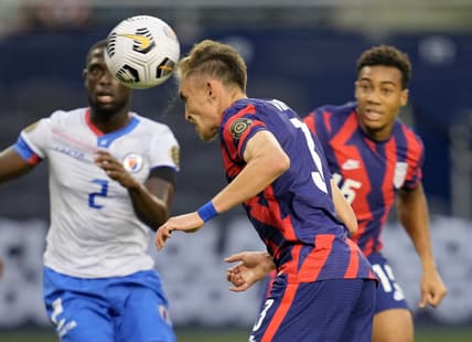 Jul 11, 2021; Kansas City, Kansas, USA; United States defender Sam Vines (3) scores a goal as Haiti defender Carlens Arcus (2) defends in the first half during a CONCACAF Gold Cup group stage soccer match at Children's Mercy Park. Mandatory Credit: Jay Biggerstaff-USA TODAY Sports