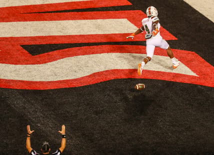 Miami's Jaylan Knighton spreads his arms as he swooped into the end zone easily after a 50-plus yard TD run against the Cards during the Louisville-Miami game Saturday night. Sept. 19, 2020

Louisville Vs Miami 2020