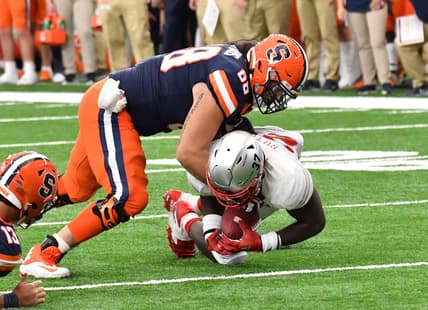 Sep 11, 2021; Syracuse, New York, USA; Rutgers Scarlet Knights defensive lineman CJ Onyechi (26) recovers a fumble as Syracuse Orange offensive lineman Airon Servais (68) tackles during the fourth quarter at the Carrier Dome. Mandatory Credit: Mark Konezny-USA TODAY Sports