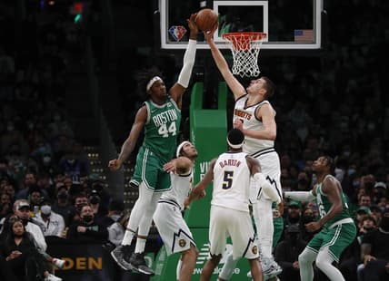 Feb 11, 2022; Boston, Massachusetts, USA; Boston Celtics center Robert Williams III (44) and center Denver Nuggets center Nikola Jokic (15) go for a rebound during the second quarter at TD Garden. Mandatory Credit: Winslow Townson-USA TODAY Sports