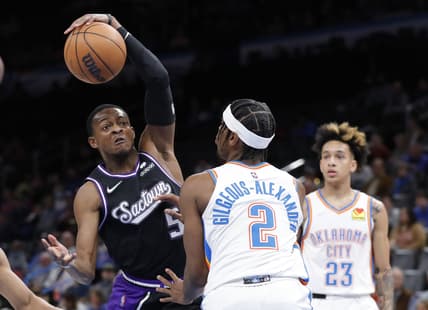 Feb 28, 2022; Oklahoma City, Oklahoma, USA; Sacramento Kings guard De'Aaron Fox (5) drives to the basket as Oklahoma City Thunder guard Shai Gilgeous-Alexander (2) defends during the first quarter at Paycom Center. Mandatory Credit: Alonzo Adams-USA TODAY Sports