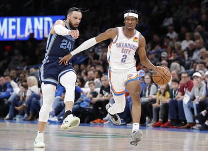 Mar 13, 2022; Oklahoma City, Oklahoma, USA; Oklahoma City Thunder guard Shai Gilgeous-Alexander (2) dribbles the ball down the court ahead of Memphis Grizzlies forward Dillon Brooks (24) during the second quarter at Paycom Center. Mandatory Credit: Alonzo Adams-USA TODAY Sports