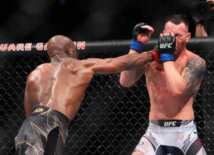 Nov 6, 2021; New York, NY, USA; Kamaru Usman (red gloves) competes against Colby Covington (blue gloves) during UFC 268 at Madison Square Garden. Mandatory Credit: Ed Mulholland-USA TODAY Sports
