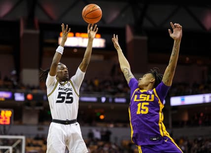 Feb 1, 2023; Columbia, Missouri, USA; Missouri Tigers guard Sean East II (55) shoots over LSU Tigers forward Tyrell Ward (15) during the first half at Mizzou Arena. Mandatory Credit: Jay Biggerstaff-USA TODAY Sports