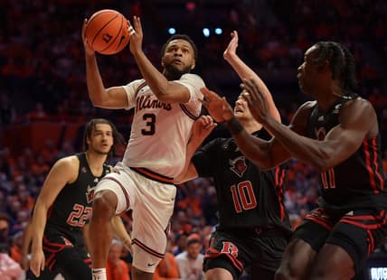 Feb 11, 2023; Champaign, Illinois, USA;  Illinois Fighting Illini guard Jayden Epps (3) drives past Rutgers Scarlet Knights guard Cam Spencer (10) during the first half at State Farm Center. Mandatory Credit: Ron Johnson-USA TODAY Sports
