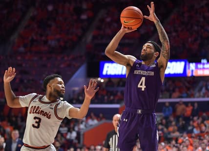 Feb 23, 2023; Champaign, Illinois, USA; Northwestern Wildcats guard Boo Buie (4) shoots the ball past Illinois Fighting Illini guard Jayden Epps (3) during the second half at State Farm Center. Mandatory Credit: Ron Johnson-USA TODAY Sports