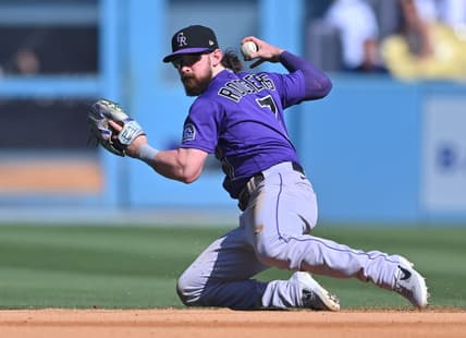 Oct 2, 2022; Los Angeles, California, USA; Colorado Rockies second baseman Brendan Rodgers (7) makes a play to throw out Los Angeles Dodgers first baseman Freddie Freeman (5) at second base in the sixth inning at Dodger Stadium. Mandatory Credit: Jayne Kamin-Oncea-USA TODAY Sports