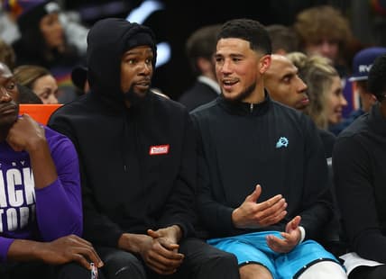 Feb 24, 2023; Phoenix, Arizona, USA; Phoenix Suns forward Kevin Durant (left) and guard Devin Booker against the Oklahoma City Thunder in the second half at Footprint Center. Mandatory Credit: Mark J. Rebilas-USA TODAY Sports
