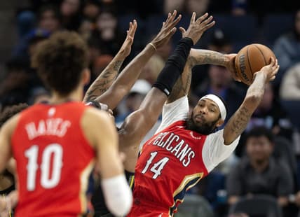 Mar 3, 2023; San Francisco, California, USA; New Orleans Pelicans forward Brandon Ingram (14) looks for a teammate to pass to as he is pressured by Golden State Warriors forward Kevon Looney during the third quarter at Chase Center. Mandatory Credit: D. Ross Cameron-USA TODAY Sports