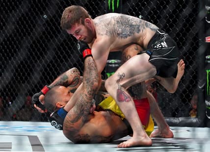 Mar 25, 2023; San Antonio, Texas, USA; Marlon Vera (red gloves) fights Cory Sandhagen (blue gloves) during UFC Fight Night at AT&T Center. Mandatory Credit: Aaron Meullion-USA TODAY Sports