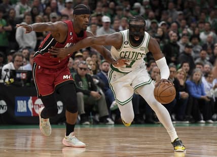 May 17, 2023; Boston, Massachusetts, USA; Boston Celtics guard Jaylen Brown (7) dribbles against Miami Heat forward Jimmy Butler (22) during the second half in game one of the Eastern Conference Finals for the 2023 NBA playoffs at TD Garden. Mandatory Credit: Bob DeChiara-USA TODAY Sports
