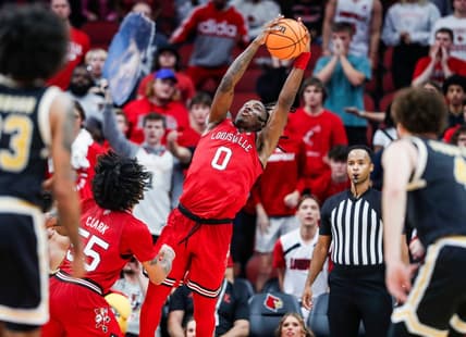 Louisville Cardinals guard Mike James (0) grabs a rebound Monday night. James had a25 points and 10 rebounds as the Cards beat UMBC 94-93. Nov.6, 2023.