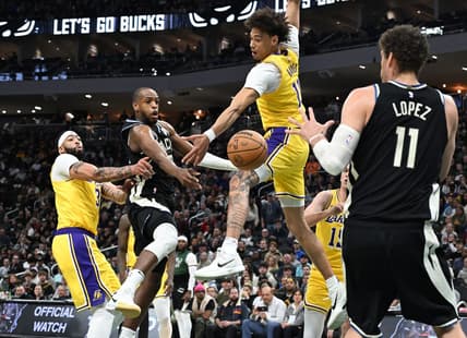 Mar 26, 2024; Milwaukee, Wisconsin, USA; Milwaukee Bucks forward Khris Middleton (22) drives tot the basket against Los Angeles Lakers center Jaxson Hayes (11) in the first half at Fiserv Forum. Mandatory Credit: Michael McLoone-USA TODAY Sports
