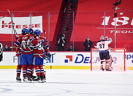Jun 6, 2021; Montreal, Quebec, CAN; Montreal Canadiens forward Corey Perry (94) reacts with teammates after scoring a goal against Winnipeg Jets goalie Connor Hellebuyck (37) during the first period in game three of the second round of the 2021 Stanley Cup Playoffs at the Bell Centre. Mandatory Credit: Eric Bolte-USA TODAY Sports