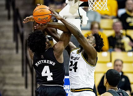 Feb 20, 2022; Columbia, Missouri, USA; Missouri Tigers forward Kobe Brown (24) blocks the shot of Mississippi State Bulldogs guard Cameron Matthews (4) during the first half at Mizzou Arena. Mandatory Credit: Jay Biggerstaff-USA TODAY Sports