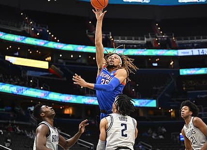 Feb 24, 2022; Washington, District of Columbia, USA; DePaul Blue Demons forward Brandon Johnson (35) shoots over Georgetown Hoyas guard Dante Harris (2) during the first half at Capital One Arena. Mandatory Credit: Brad Mills-USA TODAY Sports